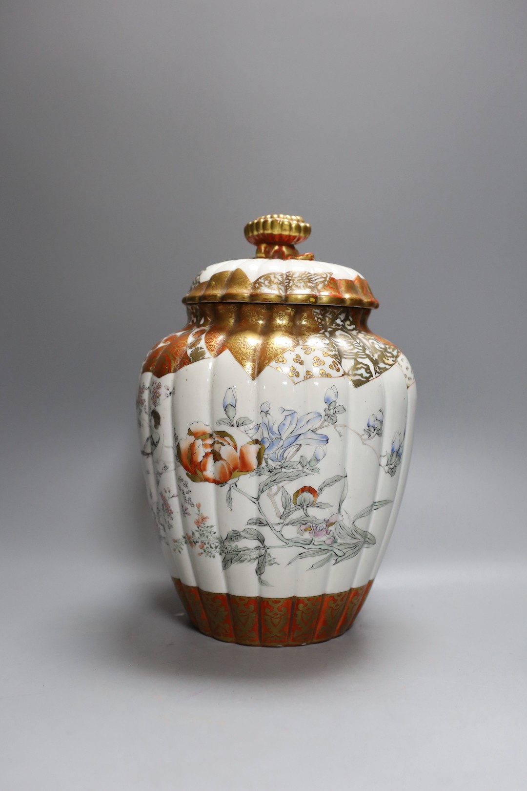 A Japanese kutani bottle vase, similar vase and cover (a.f), an Imari bowl and blue and white bowl. Largest 27cm